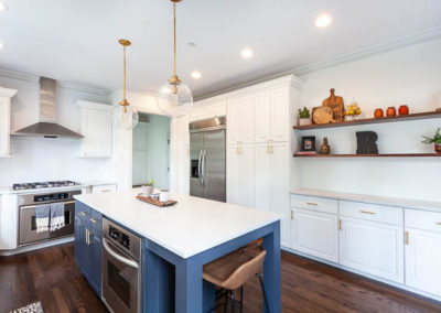 kitchen remodel simply white quartz brass curved banquette staircase remodel square baluster square newel post blue island