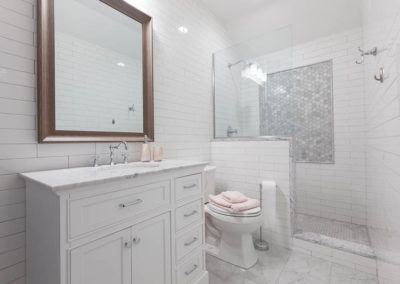 ensuite transitional bathroom clarendon hills illinois marble subway shower octagon white vanity