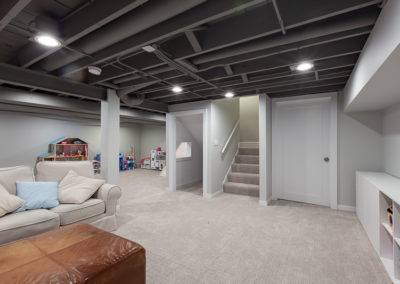 basement remodel exposed beams gray ceiling carpet clarendon hills illinois