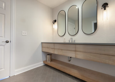 textured chevon tile powder room remodel bleached walnut oak shelf herringbone